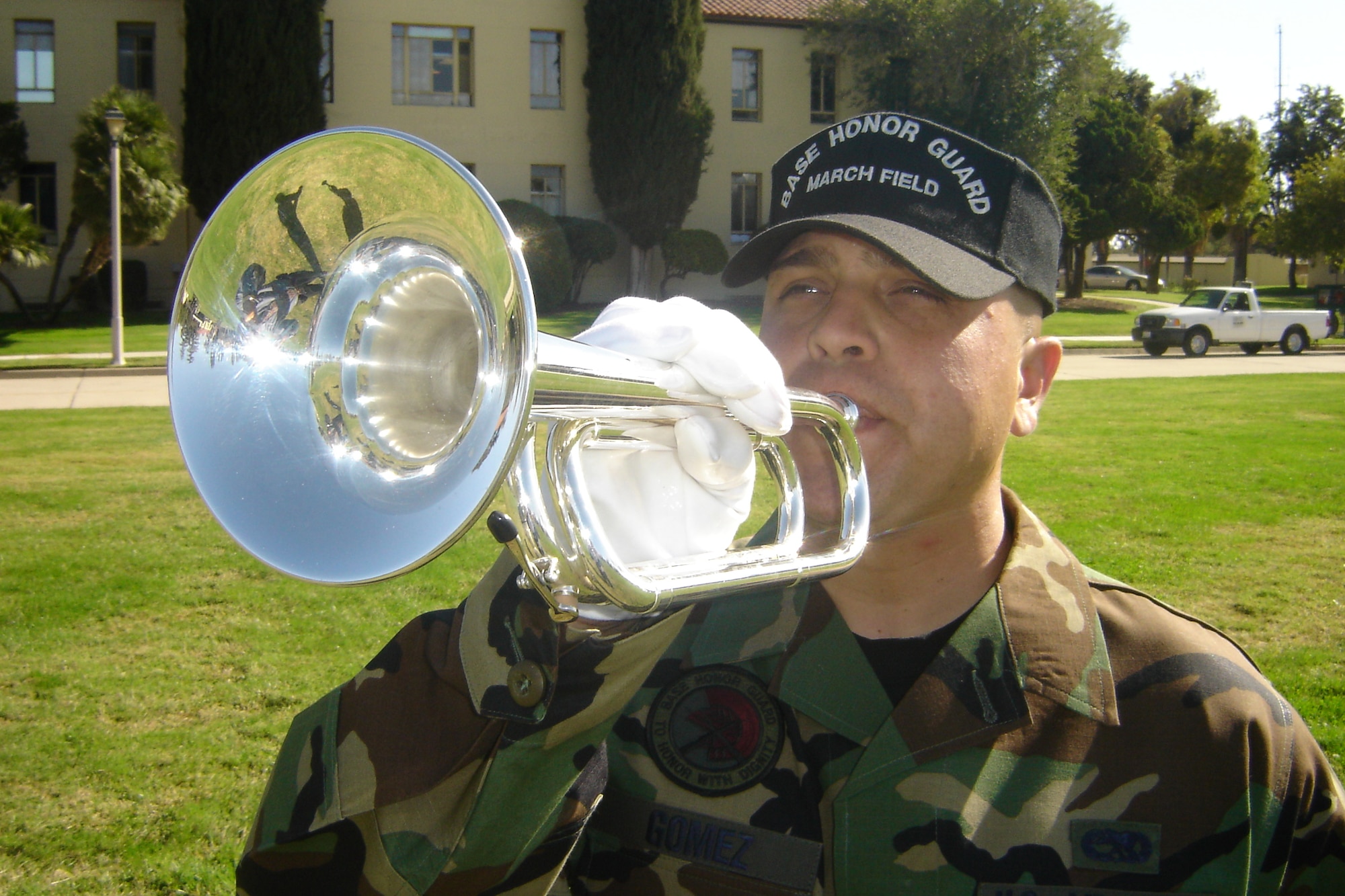 Staff Sgt. Mario Gomez, 95th Force Support Squadron, Edwards AFB, plays “Taps” during a mock funeral. (U.S. Air Force photo by Will Alexander)