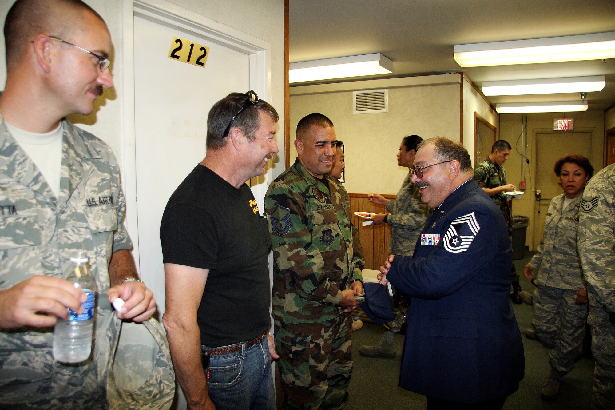 Chief Ellis thanks friends and co-workers who attended his retirement party after the official ceremony. The gathering was held at the medical group headquarters building. “I’ve been a proud member of the Air Force for a long time but it’s time for me to move on,” said Chief Ellis. “I want to give another Airman the opportunity to be promoted.” (U.S. Air Force photo)