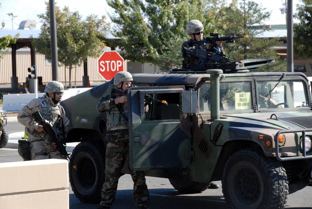 FRESNO ANGB, Calif. -- Airmen from the 144th Fighter Wing Security Forces Squadron respond to a simulated terrorist attack during the unit's Phase II Operational Readiness Exercise Nov. 1, 2008. Security Forces personnel rapidly deployed and returned fire on enemy forces who breached the base's entry control point. (U.S. Air Force photo by 1st Lt. Theresa M. Chrystal)