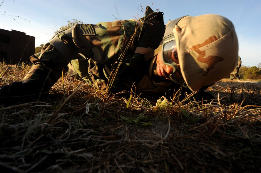 Tech. Sgt. Denise Wade, a paralegal craftsman from Malmstrom Air Force Base, Mont., performs low crawl maneuvers on a Fort Dix, N.J., range, Oct. 24, 2008, as part of functional-specific training for Airmen from the Air Force legal career field.  The students in this training learned operations law basics, contingency skills basics, rules of engagement on the use of force and expeditionary basics taught by the U.S. Air Force Expeditionary Center's legal staff.  The training is held for four days prior to the Advanced Contingency Skills Training Course taught by the center?s 421st Combat Training Squadron on Fort Dix.  (U.S. Air Force Photo/Staff Sgt. Nathan Bevier)