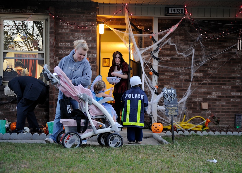 MOODY AIR FORCE BASE, Ga. --Team Moody members go door-to-door collecting candy here Oct. 31. Moody Base Housing held trick or treating from 6:00 p.m. through 8:00 p.m. on Halloween night. (U.S. Air Force photo by Senior Airman Brittany Barker)
