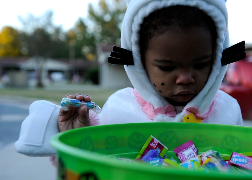 MOODY AIR FORCE BASE, Ga. – Aida Miller, 1, grabs candy from a bowl while trick or treating here Oct. 31. Moody Base Housing held trick or treating from 6 p.m. through 8 p.m. on Halloween night. (U.S. Air Force photo by Senior Airman Brittany Barker)