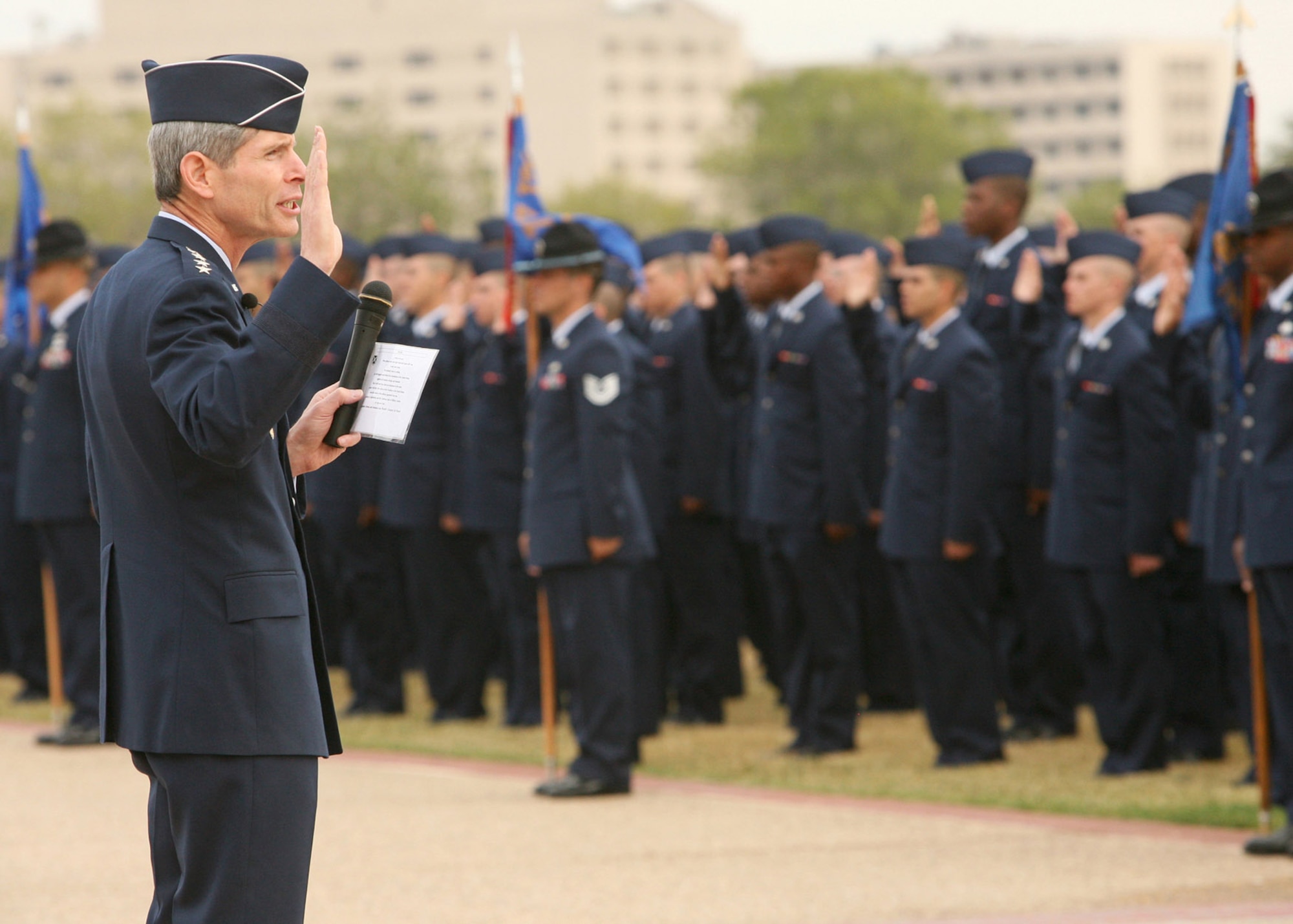 Gen. Norton Schwartz administers the oath of enlistment to Air Force Basic Military Training graduates Oct. 31 at Lackland Air Force Base, Texas. General Schwartz is the Air Force chief of staff. (U.S. Air Force photo/Robbin Cresswell) 
