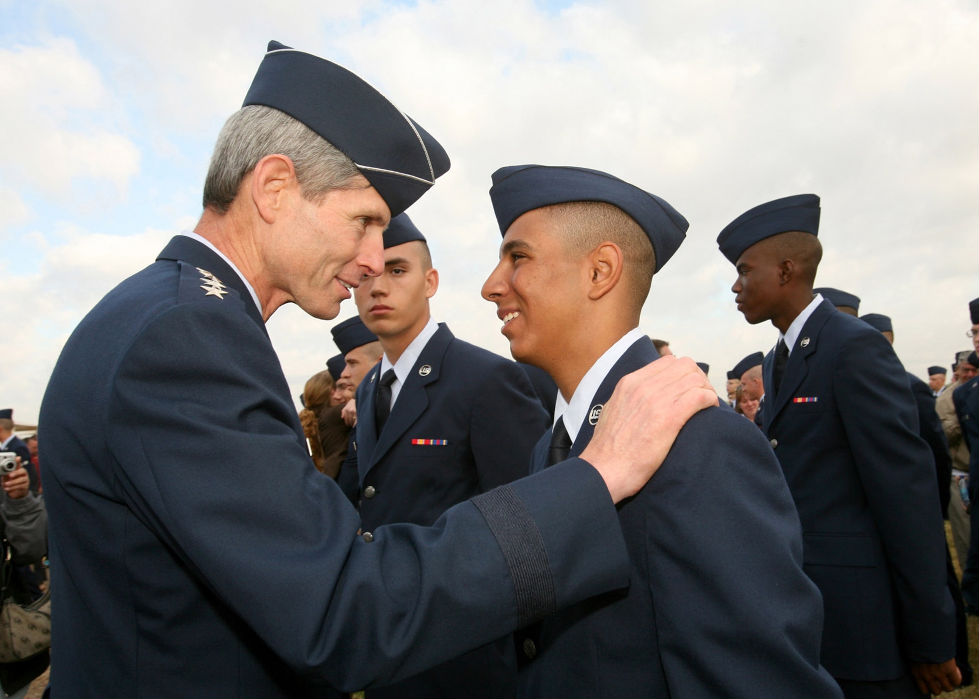 Gen. Norton Schwartz congratulates Airman Yancy Nunez on his graduation from Basic Military Training Oct. 31 at Lackland Air Force Base, Texas. While on base, General Schwartz administered the oath of enlistment to basic training graduates and served as the reviewing official for the BMT parade. Airman Nunez is from the 322nd Training Squadron, Flight 673. General Schwartz is the Air Force chief of staff. (U.S. Air Force photo/Robbin Cresswell) 

