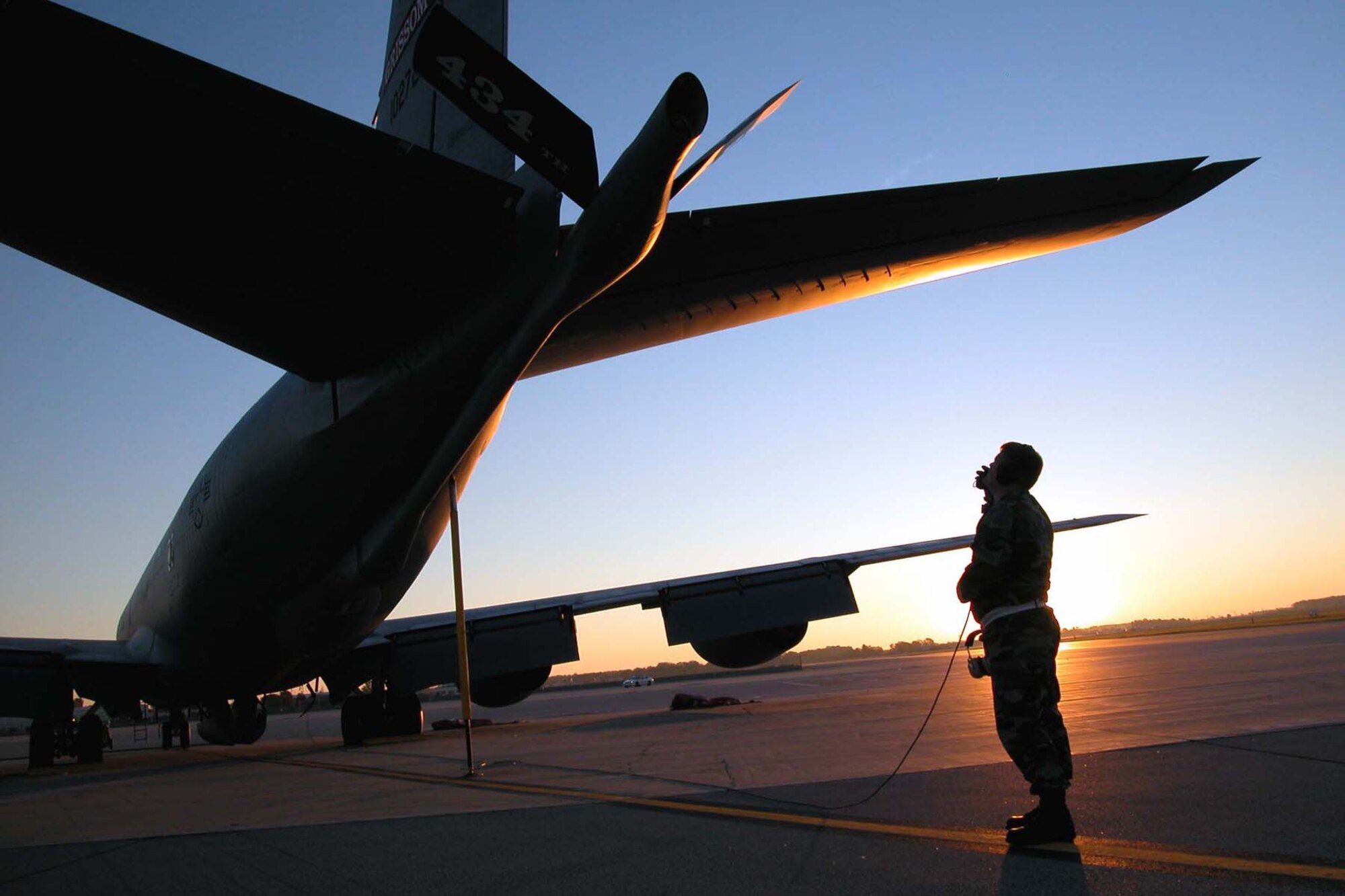 GRISSOM AIR RESERVE BASE, Ind., -- Staff Sgt. William Vansweden, a KC-135R crew chief, works to pre-flight the refueling boom on a Grissom tanker before an early morning flight.  (U.S. Air Force photo/Staff Sgt. Chris Bolen)                          