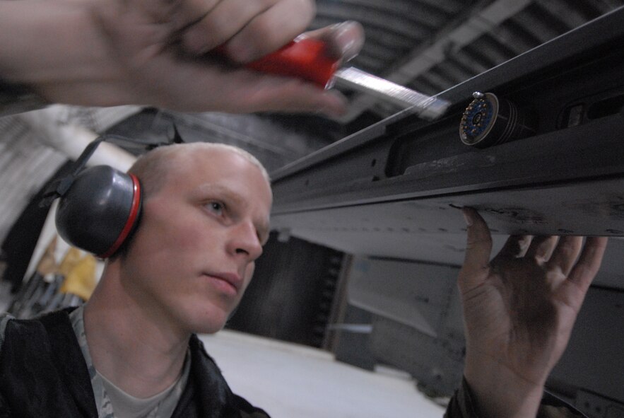 Airman 1st Class Joshua Hnatiuk, 8th Aircraft Maintenance Squadron, prepares to load missiles on an F-16 during exercise Beverly Bulldog 08-04 at Kunsan Air Base, Republic of Korea, November 4, 2008. Kunsan is participating in the Peninsula-Wide Operational Readiness Exercise as a test of its wartime capabilities and response actions. (U.S. Air Force Photo by SrA Gustavo Gonzalez)