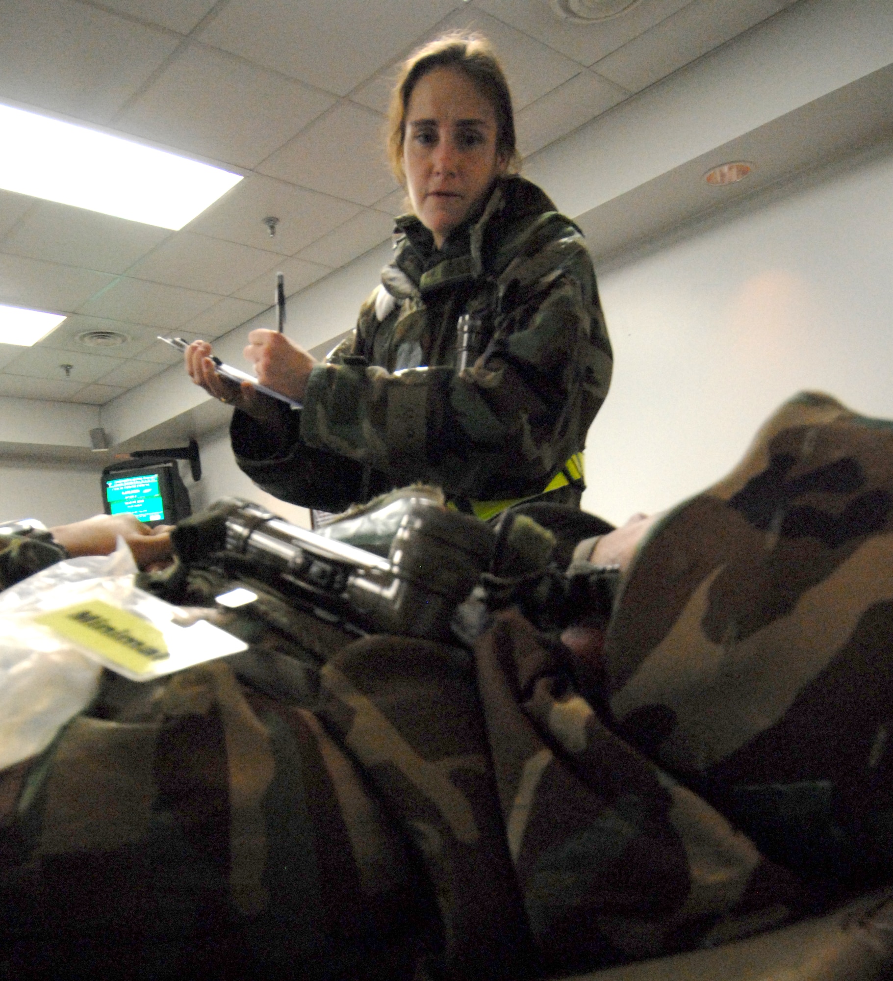 Captain Brigitte French, 8th Medical Group, treats a patient during exercise Beverly Bulldog 08-04 at Kunsan Air Base, Republic of Korea, Nov. 3, 2008. Kunsan is participating in the Peninsula-Wide Operational Readiness Exercise as a test of its wartime capabilities and response actions. (U.S. Air Force Photo by SrA Gustavo Gonzalez)