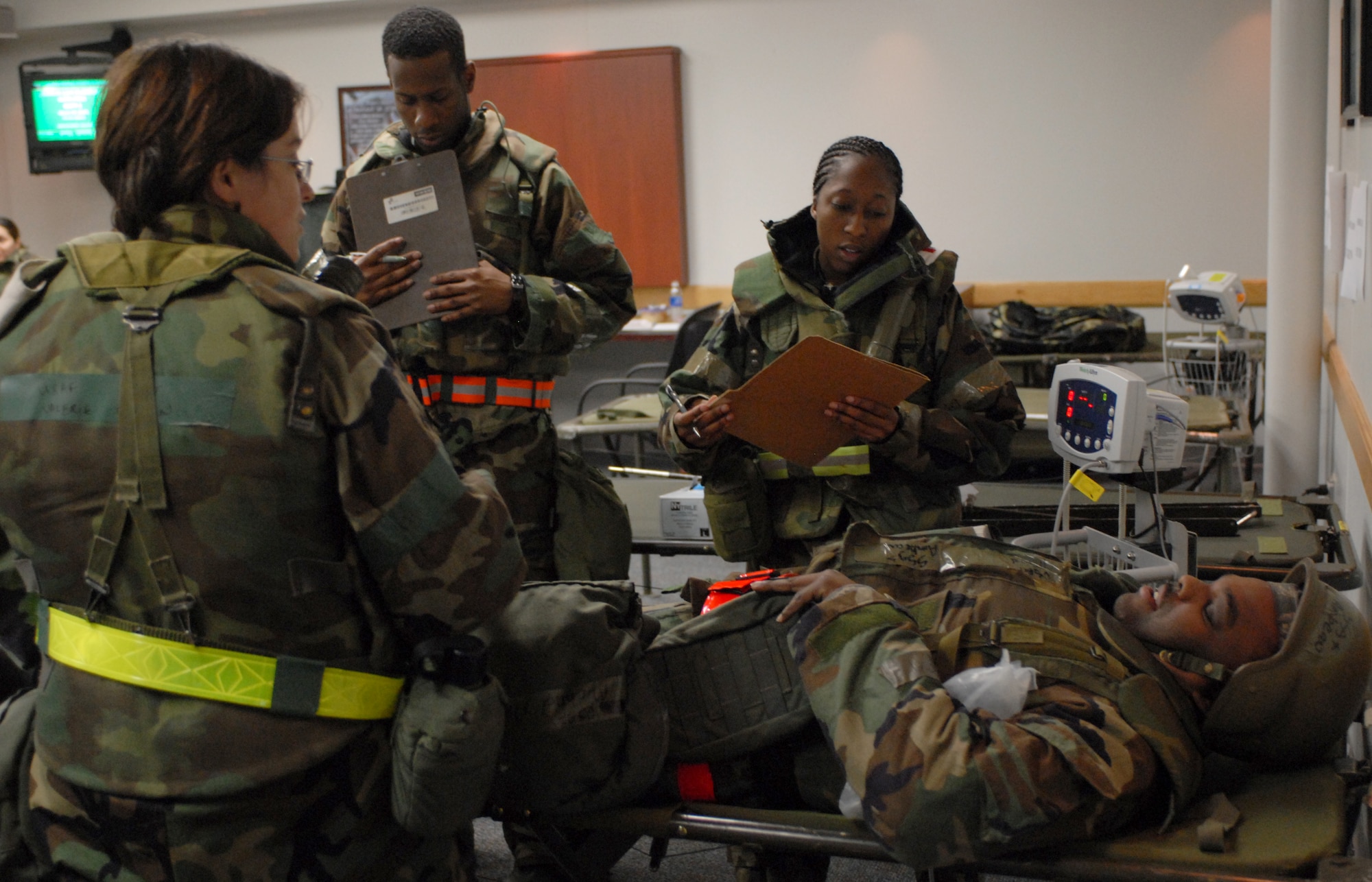 Airmen from the 8th Medical Group treat a patient during exercise Beverly Bulldog 08-04 at Kunsan Air Base, Republic of Korea, Nov. 3, 2008. Kunsan is participating in the Peninsula-Wide Operational Readiness Exercise as a test of its wartime capabilities and response actions. (U.S. Air Force Photo by SrA Gustavo Gonzalez)