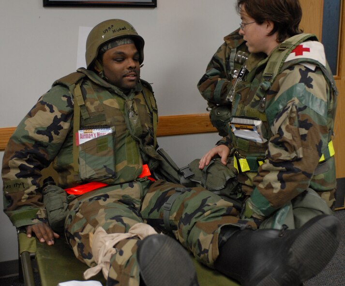 Captain Valerie Obrien, 8th Medical Group, treats a patient during exercise Beverly Bulldog 08-04 at Kunsan Air Base, Republic of Korea, Nov. 3, 2008. Kunsan is participating in the Peninsula-Wide Operational Readiness Exercise as a test of its wartime capabilities and response actions. (U.S. Air Force Photo by SrA Gustavo Gonzalez)