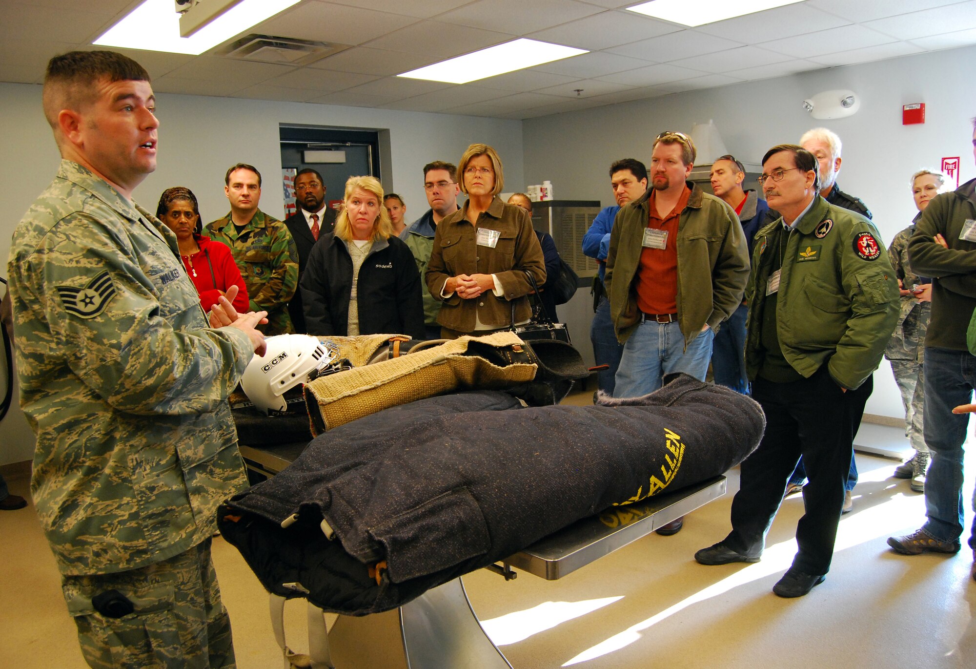 DOVER AIR FORCE BASE, Del. -- Staff Sgt. Ryan Walker, 436th Security Forces Squadron, briefs employers of 512th Airlift Wing reservists about his job at the military working dog facility on during Employer Appreciation Day here Nov. 1. The event, cosponsored by the Delaware Committee of the Employer Support of the Guard and Reserve, is designed to give employers a taste of what it?s like to be a Citizen Airman. The employers also visited the aerial port, where they learned how cargo is processed and shipped worldwide and concluded the day with a C-17 Globemaster III flight. (U.S. Air Force photo/Staff Sgt. Steve Lewis)