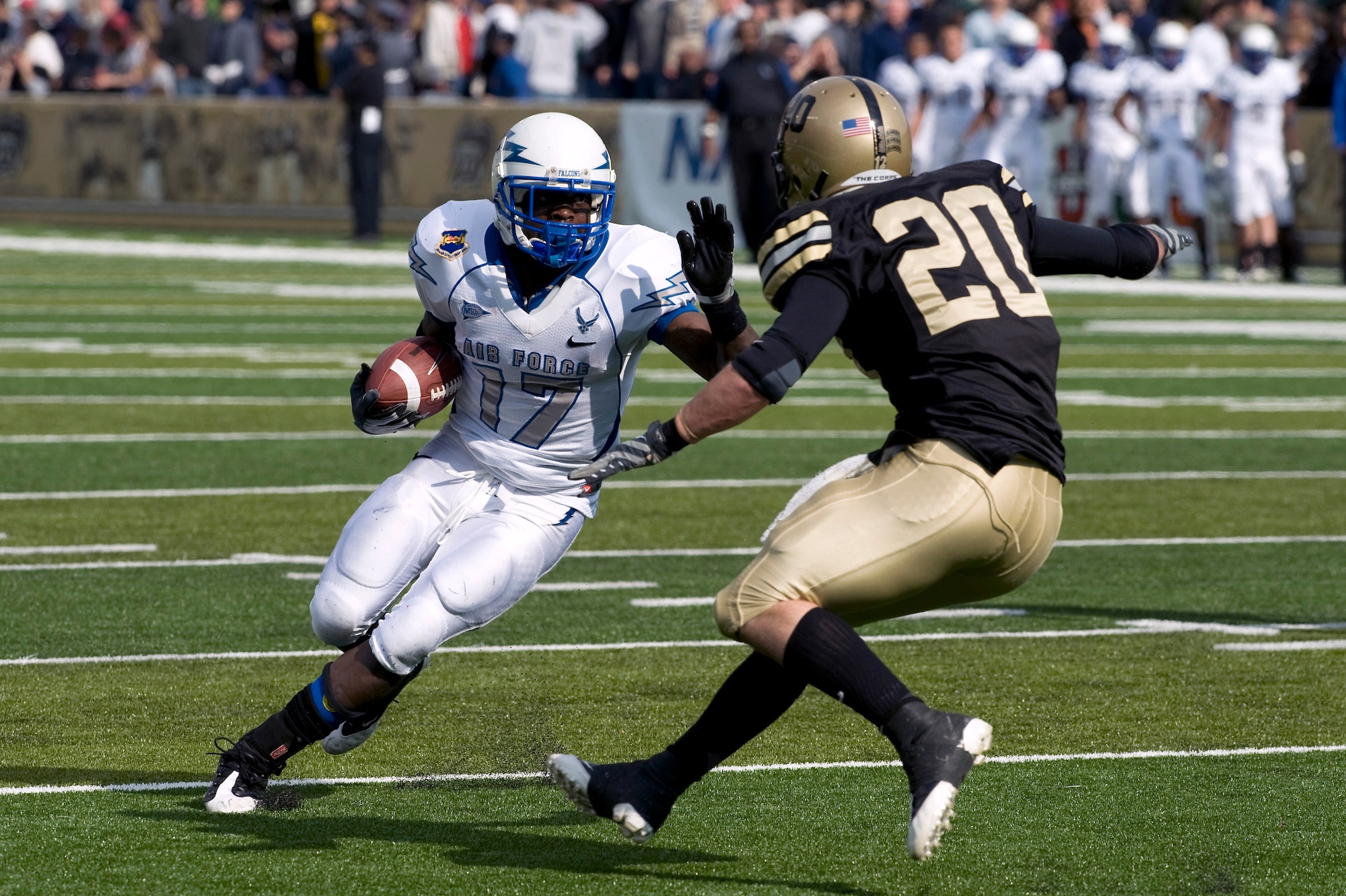 U.S. Air Force Academy quarterback Aster Clark attempts to avoid a tackle by U.S. Military Academy defensive back Lowell Garthwaite Nov. 1 at West Point, N.Y. Air Force defeated Army in their annual battle 16-7. (Defense Department photo/Navy Petty Officer 1st Class Chad J. McNeeley) 