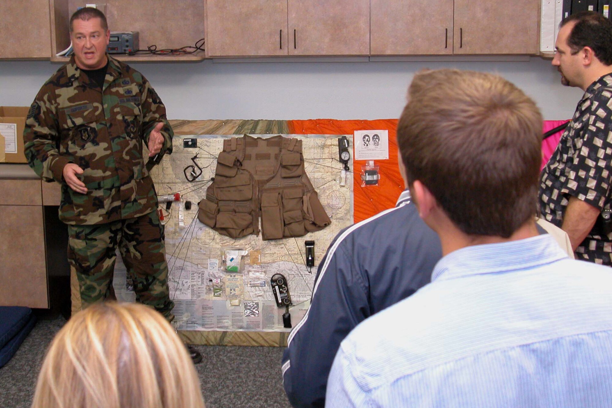 GRISSOM AIR RESERVE BASE, Ind., -- Technical Sgt. Jeff Goforth, aircrew flight equipment section, briefs members of the Grissom Community Council (GCC) on aircrew survival equipment during a base tour Nov. 1.  GCC members also toured the radar approach control facility, and the KC-135R full motion simulator.  (U.S. Air Force photo/Staff Sgt.Chris Bolen)