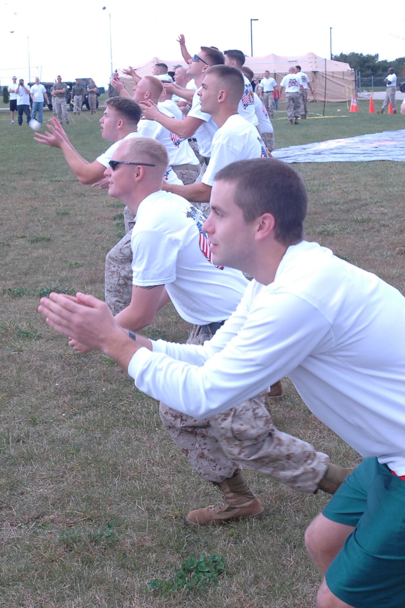GRISSOM AIR RESERVE BASE, Ind., -- Marines from the Det. 1 Communications Company and guests from the Ratheon Company in Fort Wayne, compete in a friendly egg toss competition during a special challenge day event held here recently. (U.S. Air Force photo/SrA. Carl Berry)