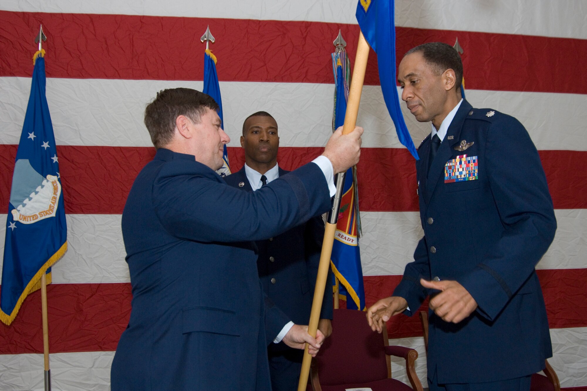 127th Wing Commander, Brigadier General Michael L. Peplinski (left), passes the Operations Group flag to Lt. Col. Leonard Isabelle Jr., newly named commander of the 127th Operations Group, at a ceremony held at Selfridge Air National Guard Base on Sunday, November 2.  (U.S. Air Force photo by SrA Jeremy Brownfield)