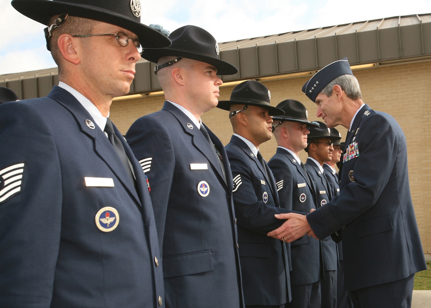 Air Force Chief of Staff Gen. Norton Schwartz shakes hands with Staff Sgt. Hector Paiz, 331st Training Squadron, after the BMT graduation Oct. 31 on Lackland Air Force Base, Texas. While on base, General Schwartz administered the Oath of Enlistment to basic training graduates and served as the reviewing official for the BMT parade. (U.S. Air Force photo/Robbin Cresswell)  