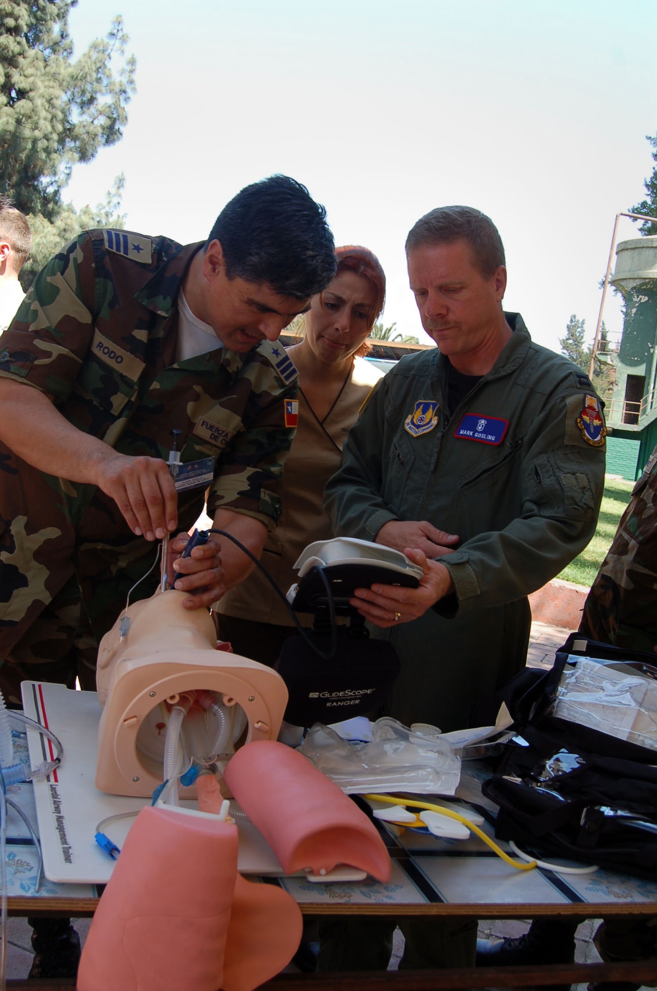 Lt. Col. Alger Rodo, the medical exchange coordinator for the Chilean Air Force, intubates, or inserts a tube into, the throat of a practice patient as U.S. Air Force Capt. Mark Gosling, from Brookes City-Base, San Antonio, instructs. Captain Gossling is part of about 70 Airmen participating in Operation Southern Partner, a Twelfth Air Force (Air Forces Southern) led event aimed at providing intensive, periodic subject-matter exchanges in the U.S. Southern Command area of focus, started Oct. 26. (Air Force photo/Master Sgt. Eric M. Grill)