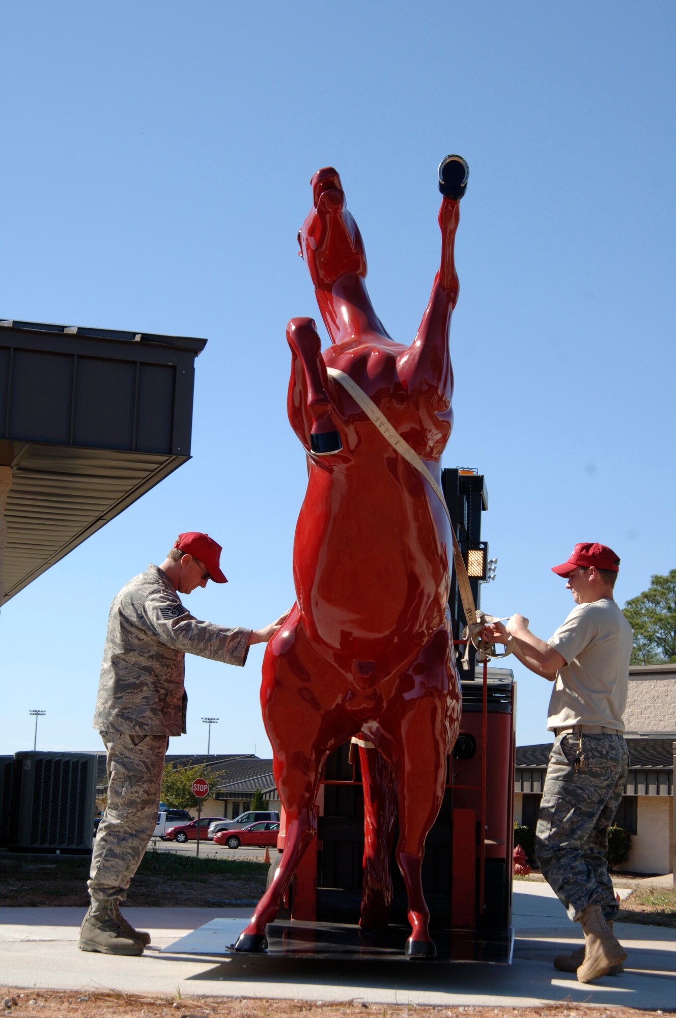 HURLBURT FIELD, Fla. -- Staff Sgt. Chris Becvar and Tech. Sgt. Toby Stapleton, both assigned to the 556th RED HORSE Squadron, install the RESD HORSE mascot here, Nov. 1. The 556 RHS, a combat support reserve unit, mirrors the active-duty 823rd RED HORSE Squadron, also located at Hurlburt Field. The two units are bedded down together as part of the Air Force's total force integration initiative. (U.S. photo by Senior Airman Sheila deVera)