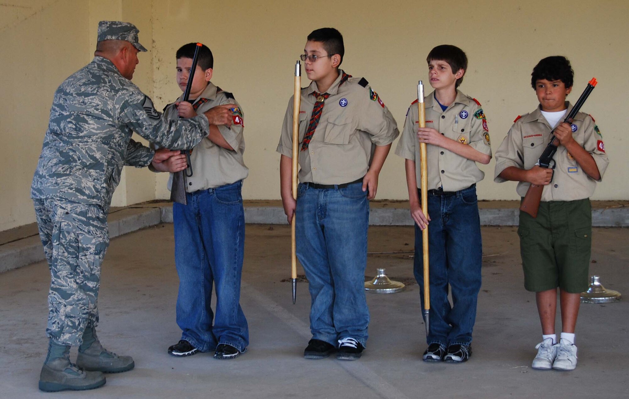 Boy Scout Troop 413 from New Braunfels, Texas spent a few hours learning how to perform basic moves associated with posting the colors. Reservists with the 433rd Airlift Wing, all members of the Lackland Base Honor Guard, volunteered the day to instruct the boys on October 25, 2008. The boys learned proper marching, facing movements and how to carry the rifles and the flags. Wing members said the boys worked hard and showed determination and that they would volunteer to do it again because of the personal satisfaction they gained during the instruction day. Troop 413 also toured the Inter-American Air Forces Academy training aircraft after their training and a park clean-up project on Lackland. (U.S. Air Force Courtesy Photo)