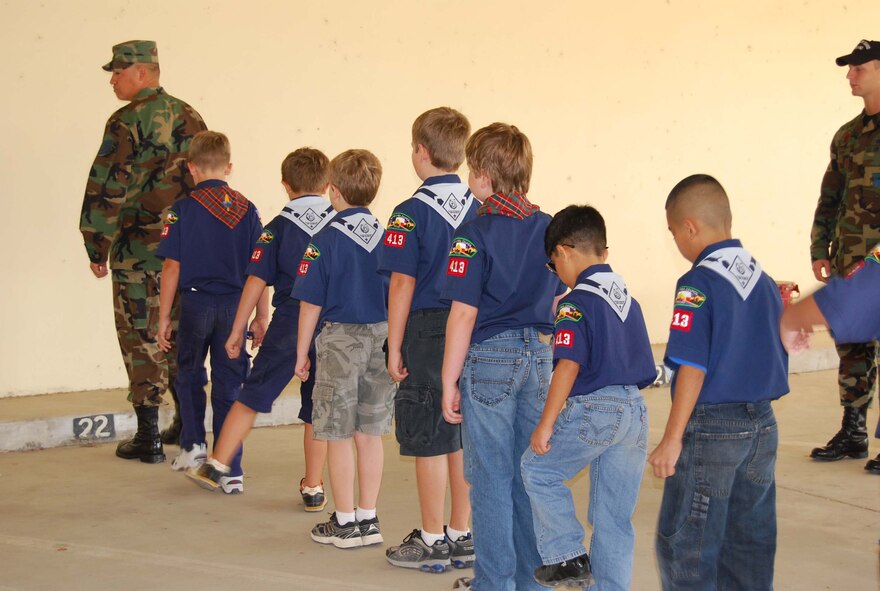 Boy Scout Troop 413 from New Braunfels, Texas spent a few hours learning how to perform basic moves associated with posting the colors. Reservists with the 433rd Airlift Wing, all members of the Lackland Base Honor Guard, volunteered the day to instruct the boys on October 25, 2008. The boys learned proper marching, facing movements and how to carry the rifles and the flags. Wing members said the boys worked hard and showed determination and that they would volunteer to do it again because of the personal satisfaction they gained during the instruction day. Troop 413 also toured the Inter-American Air Forces Academy training aircraft after their training and a park clean-up project on Lackland. (U.S. Air Force Courtesy Photo)