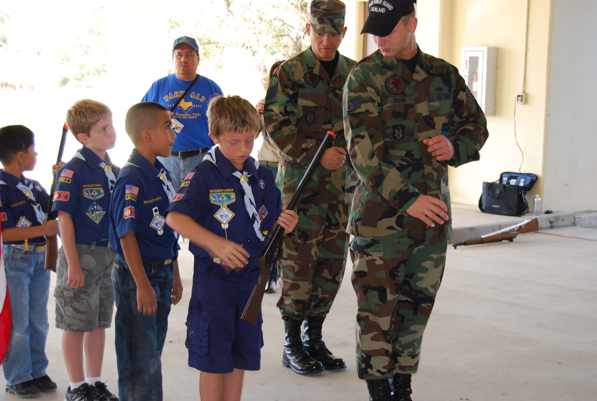 Boy Scout Troop 413 from New Braunfels, Texas spent a few hours learning how to perform basic moves associated with posting the colors. Reservists with the 433rd Airlift Wing, all members of the Lackland Base Honor Guard, volunteered the day to instruct the boys on October 25, 2008. The boys learned proper marching, facing movements and how to carry the rifles and the flags. Wing members said the boys worked hard and showed determination and that they would volunteer to do it again because of the personal satisfaction they gained during the instruction day. Troop 413 also toured the Inter-American Air Forces Academy training aircraft after their training and a park clean-up project on Lackland. (U.S. Air Force Courtesy Photo)