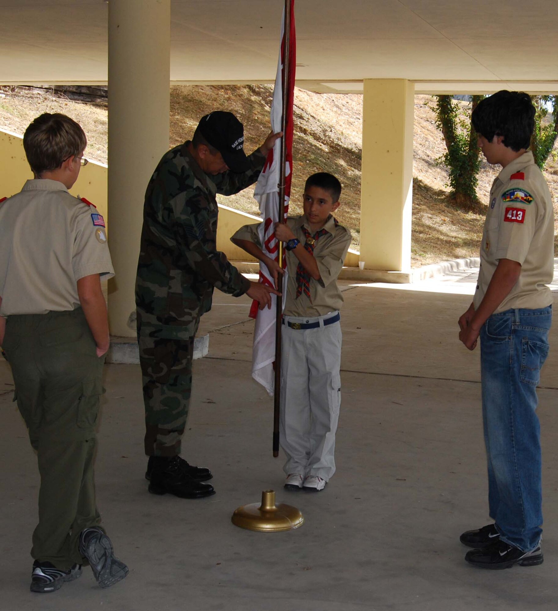 Boy Scout Troop 413 from New Braunfels, Texas spent a few hours learning how to perform basic moves associated with posting the colors. Reservists with the 433rd Airlift Wing, all members of the Lackland Base Honor Guard, volunteered the day to instruct the boys on October 25, 2008. The boys learned proper marching, facing movements and how to carry the rifles and the flags. Wing members said the boys worked hard and showed determination and that they would volunteer to do it again because of the personal satisfaction they gained during the instruction day. Troop 413 also toured the Inter-American Air Forces Academy training aircraft after their training and a park clean-up project on Lackland. (U.S. Air Force Courtesy Photo)