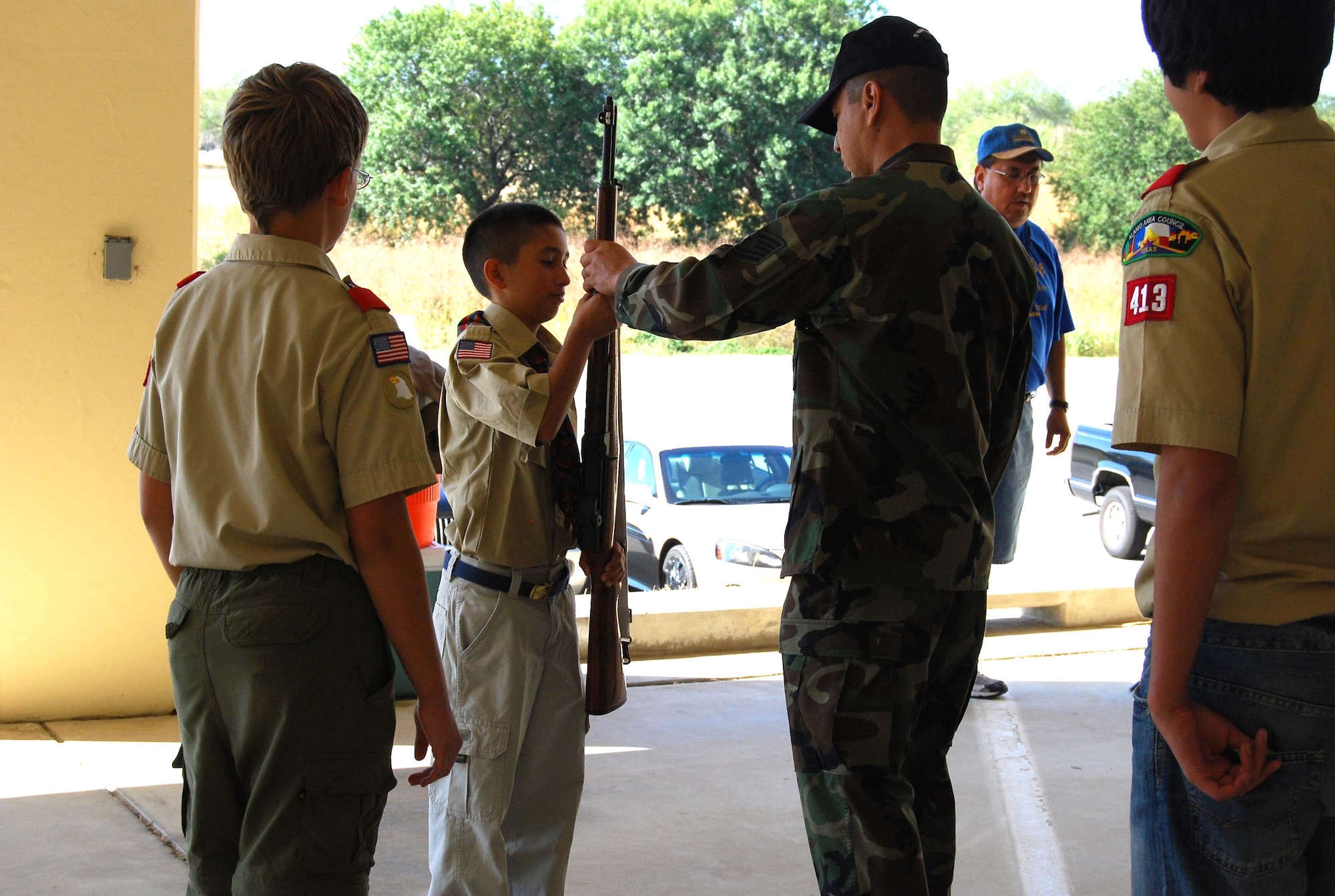 Boy Scout Troop 413 from New Braunfels, Texas spent a few hours learning how to perform basic moves associated with posting the colors. Reservists with the 433rd Airlift Wing, all members of the Lackland Base Honor Guard, volunteered the day to instruct the boys on October 25, 2008. The boys learned proper marching, facing movements and how to carry the rifles and the flags. Wing members said the boys worked hard and showed determination and that they would volunteer to do it again because of the personal satisfaction they gained during the instruction day. Troop 413 also toured the Inter-American Air Forces Academy training aircraft after their training and a park clean-up project on Lackland. (U.S. Air Force Courtesy Photo)