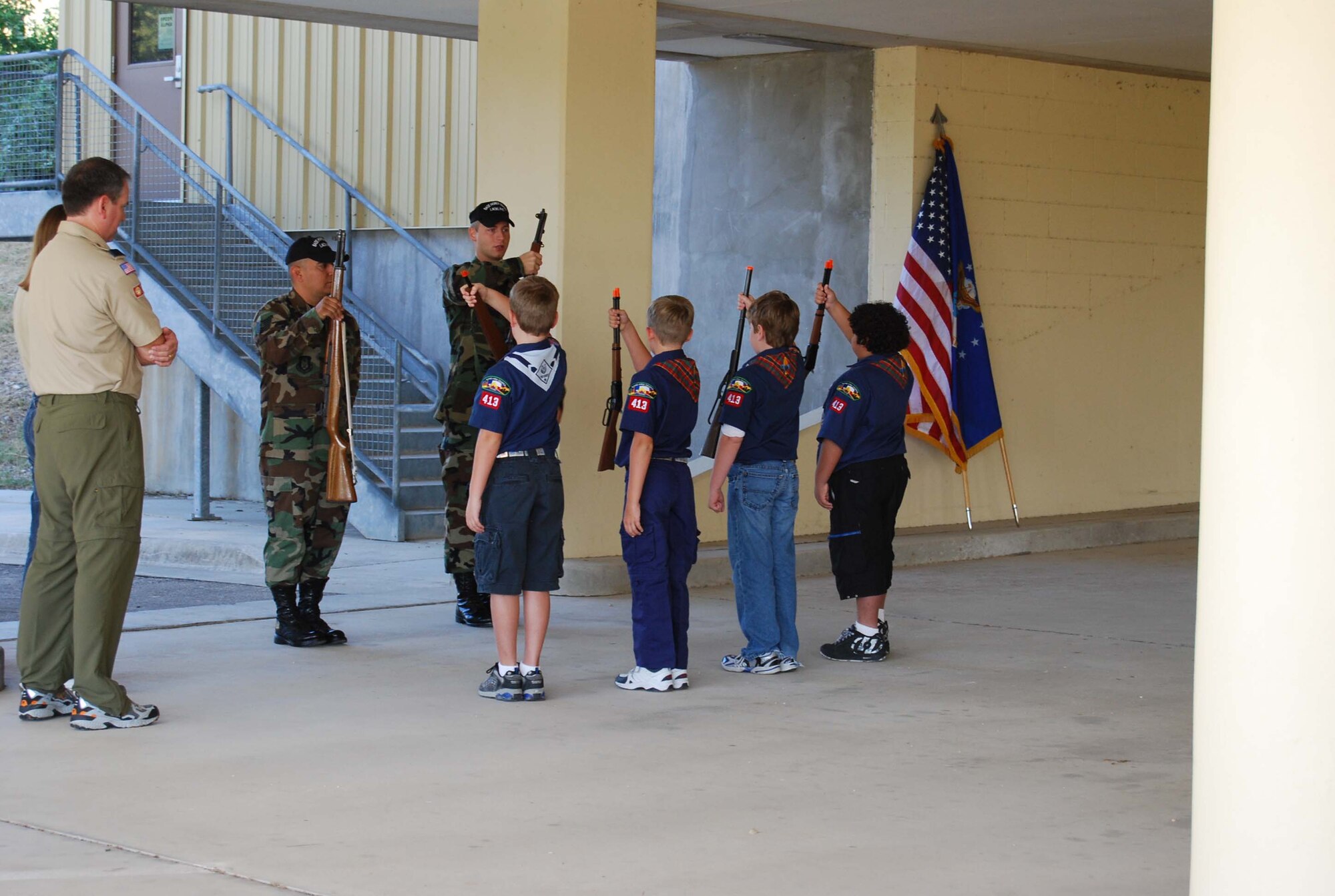 Boy Scout Troop 413 from New Braunfels, Texas spent a few hours learning how to perform basic moves associated with posting the colors. Reservists with the 433rd Airlift Wing, all members of the Lackland Base Honor Guard, volunteered the day to instruct the boys on October 25, 2008. The boys learned proper marching, facing movements and how to carry the rifles and the flags. Wing members said the boys worked hard and showed determination and that they would volunteer to do it again because of the personal satisfaction they gained during the instruction day. Troop 413 also toured the Inter-American Air Forces Academy training aircraft after their training and a park clean-up project on Lackland. (U.S. Air Force Courtesy Photo)