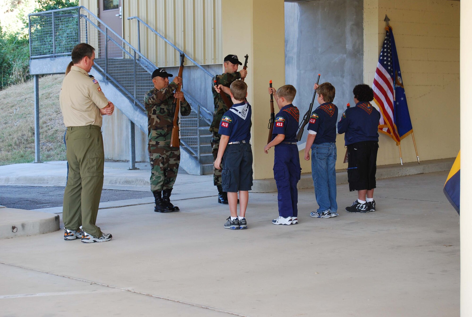 Boy Scout Troop 413 from New Braunfels, Texas spent a few hours learning how to perform basic moves associated with posting the colors. Reservists with the 433rd Airlift Wing, all members of the Lackland Base Honor Guard, volunteered the day to instruct the boys on October 25, 2008. The boys learned proper marching, facing movements and how to carry the rifles and the flags. Wing members said the boys worked hard and showed determination and that they would volunteer to do it again because of the personal satisfaction they gained during the instruction day. Troop 413 also toured the Inter-American Air Forces Academy training aircraft after their training and a park clean-up project on Lackland. (U.S. Air Force Courtesy Photo)