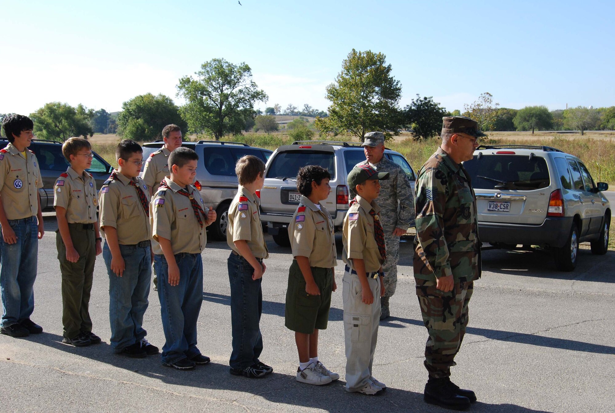 Boy Scout Troop 413 from New Braunfels, Texas spent a few hours learning how to perform basic moves associated with posting the colors. Reservists with the 433rd Airlift Wing, all members of the Lackland Base Honor Guard, volunteered the day to instruct the boys on October 25, 2008. The boys learned proper marching, facing movements and how to carry the rifles and the flags. Wing members said the boys worked hard and showed determination and that they would volunteer to do it again because of the personal satisfaction they gained during the instruction day. Troop 413 also toured the Inter-American Air Forces Academy training aircraft after their training and a park clean-up project on Lackland. (U.S. Air Force Courtesy Photo)