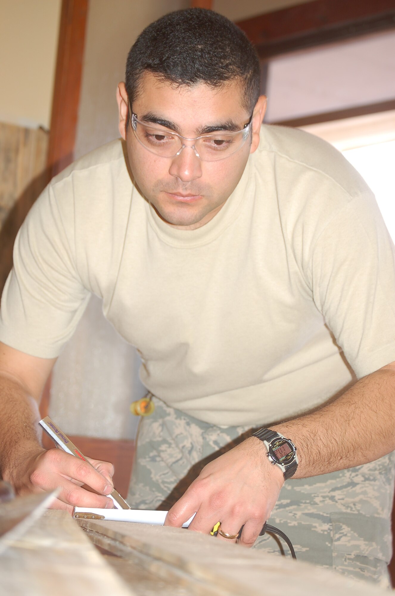 Staff Sgt. Lorenzo Lara, a structural craftsman Rapid Engineer Deployable Heavy Operational Repair Squadron Engineer from the 819th RED HORSE Squadron at Malmstrom Air Force Base, Mont., measures a wooden slat before cutting it to use as part of a library renovation project at a Chilean culinary and hotel service high school in Quilpué, Chile on Oct. 31. Sergeant Lara and Master Sgt. Roger Wilhelm, also from 819th RED HORSE (not pictured) finished the renovation as part of Operation Southern Partner -- a two-week Twelfth Air Force (Air Forces Southern) led event aimed at providing intensive, periodic subject matter exchanges with partner nations in the U.S. Southern Command area of focus. (Air Force photo/Master Sgt. Eric M. Grill)