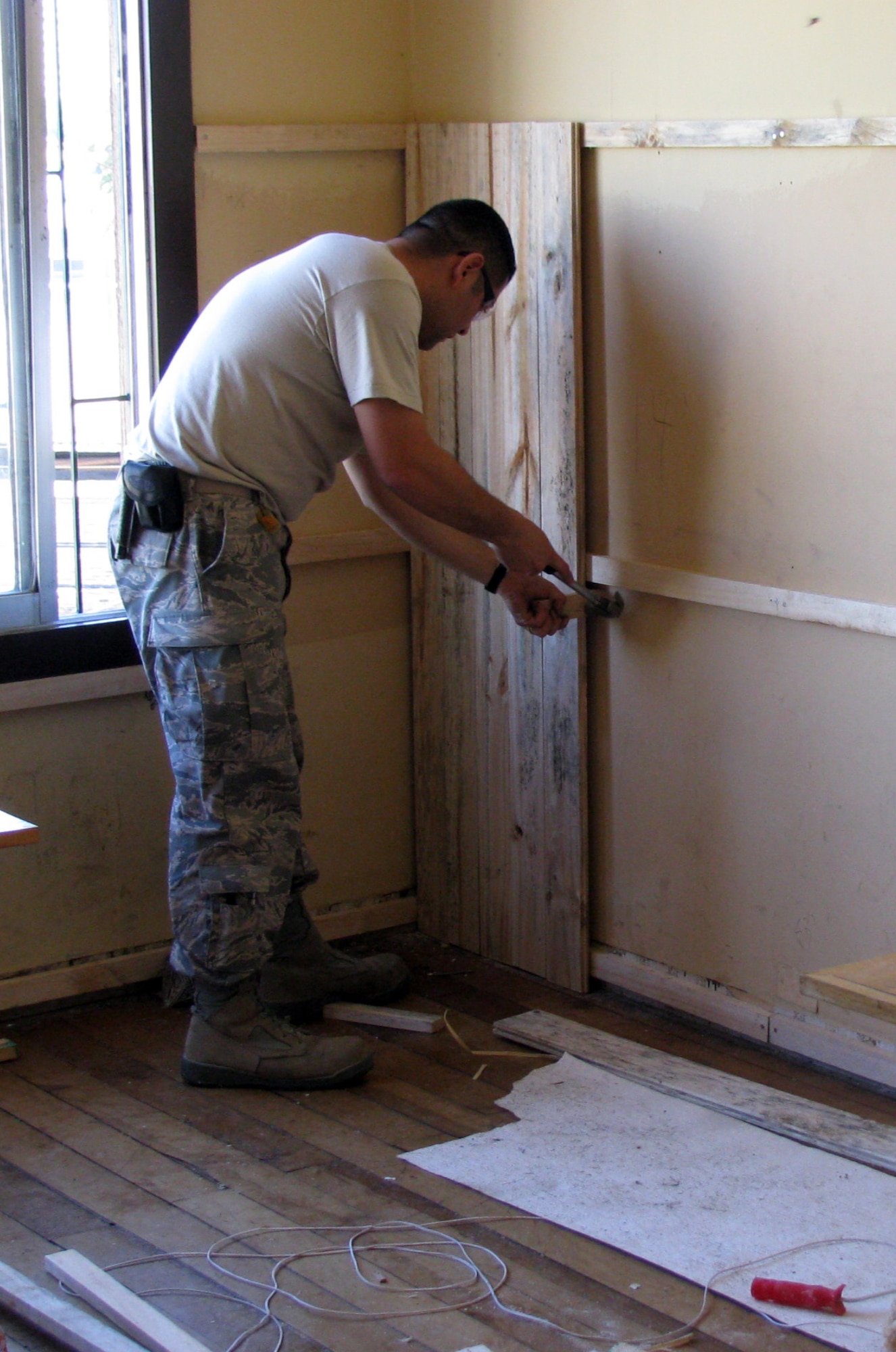 Staff Sgt. Lorenzo Lara, one of two Rapid Engineer Deployable Heavy Operational Repair Squadron Engineer, or RED HORSE Airmen completed renovations of a dilapidated library at a Chilean culinary and hotel service high school in Quilpae, Chile Oct. 31 giving 80 students a comfortable and usable library the students and faculty can use for years to come. The renovation, the result of Operation Southern Partner ? a two-week Twelfth Air Force (Air Forces Southern) led event aimed at providing intensive, periodic subject matter exchanges with partner nations in the U.S. Southern Command area of focus ? took the two RED HORSE Airmen, and their Chilean civilian counterparts four days to complete; three days ahead of schedule. (Air Force photo/Master Sgt. Roger Wilhelm)