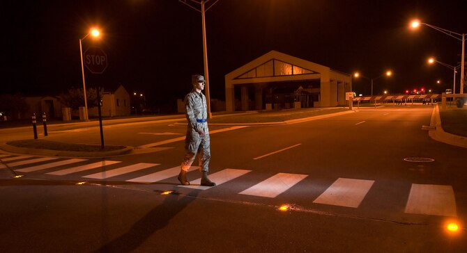 An Airman crosses Atlantic Avenue using one of three crosswalks with the newly-installed light system. The new lights will make crosswalks safer for pedestrians.  The crosswalks were paid for using funds from the 2008 Commander in Chief's Annual Award for Installation Excellence.    (U.S. Air Force photo/Jason Minto) 