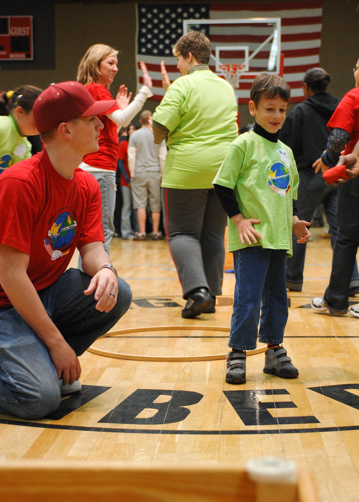 SPANGDAHLEM AIR BASE, Germany -- Jarome Ongaro, a student at St. Martin’s School,  talks with his sponsor, Kip Holmstead, during St. Martin's Children's Day, Oct. 30, 2008. (U.S. Air Force photo by Airman 1st Class Nathanael Callon)