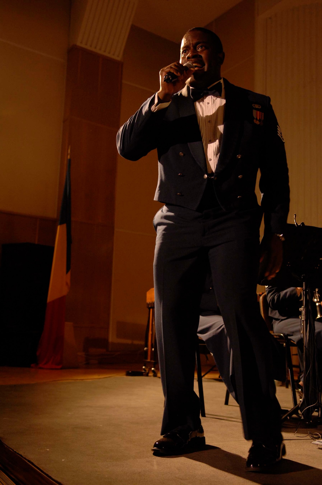 U.S. Air Force Staff Sgt. Andre Rascoe, U.S. Air Forces in Europe Concert Band vocalist, sings "Accentuate the Positive" at the Nae Leonard Musical Theater, Galati, Romania, Nov. 1, 2008. The USAFE Concert Band brings the sound of America to Europe?s finest concert halls and theaters. (U.S. Air Force photo by Senior Airman Amber Bressler)