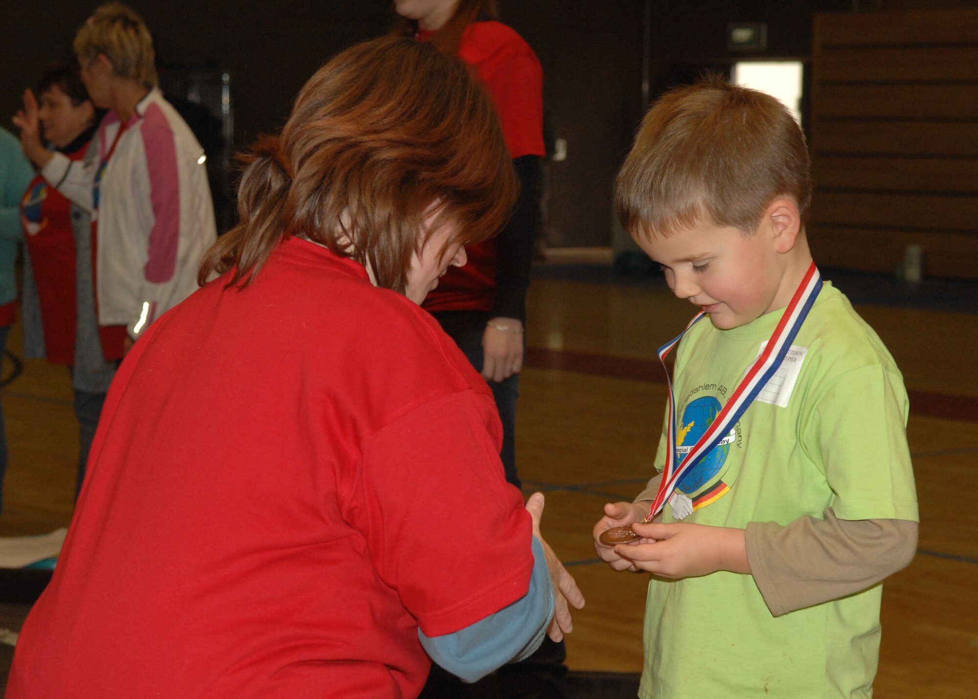 SPANGDAHLEM AIR BASE, Germany –- Christopher Maetteson receives a medal for his participation in the St. Martin’s Children’s day games, Oct. 30, 2008. The event hosted over 100 German National students and four Department of Defense students. (U.S. Air Force photo by Airman Staci Miller)