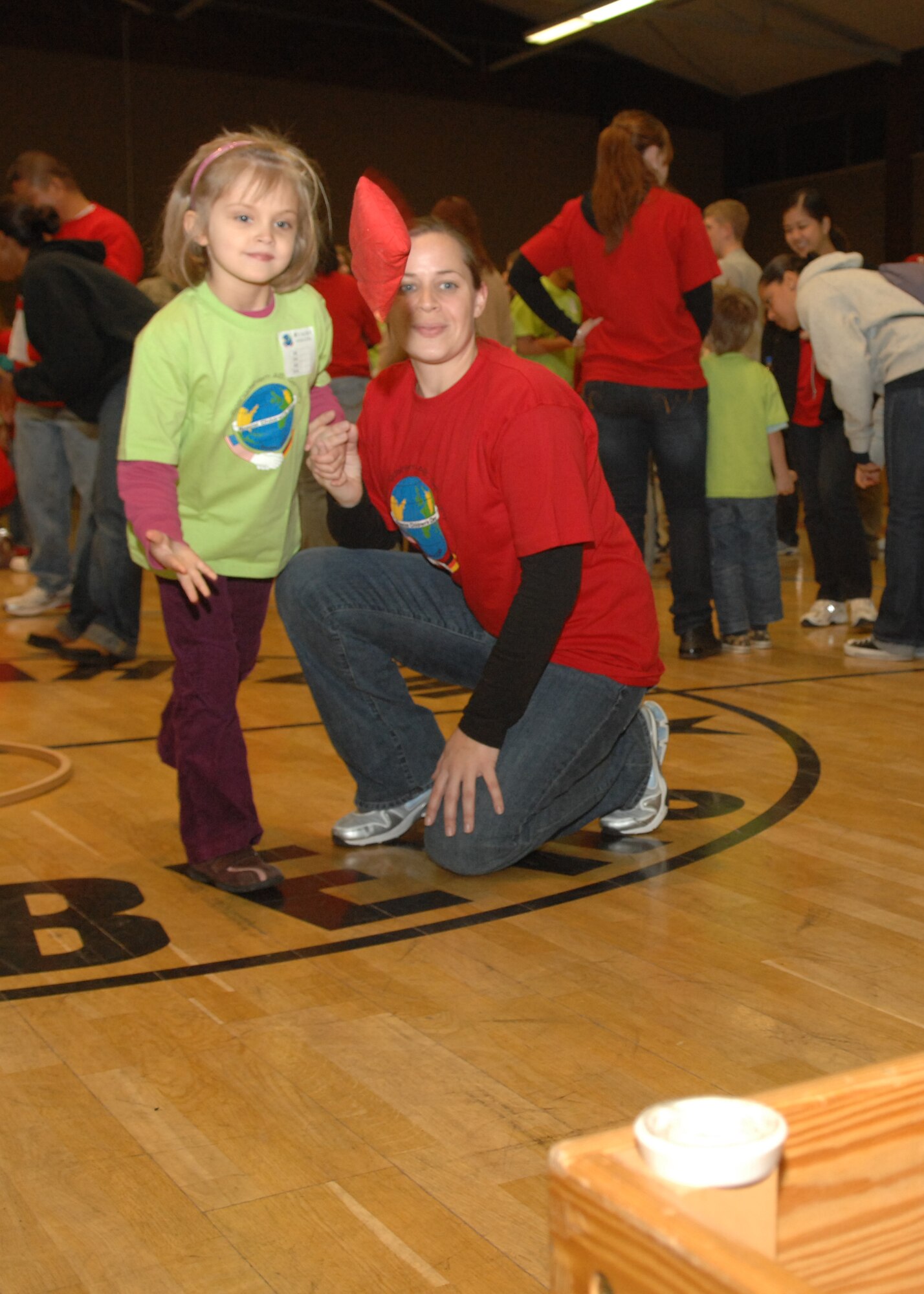 SPANGDAHLEM AIR BASE, Germany –-Anna-Lena Vickert and her sponsor, Caylene Pavich, take part in bag-toss, one of the several games held at St. Martin’s Children’s day, Oct. 30, 2008. The event hosted over 100 German National students and four Department of Defense students.  (U.S. Air Force photo by Airman Staci Miller)