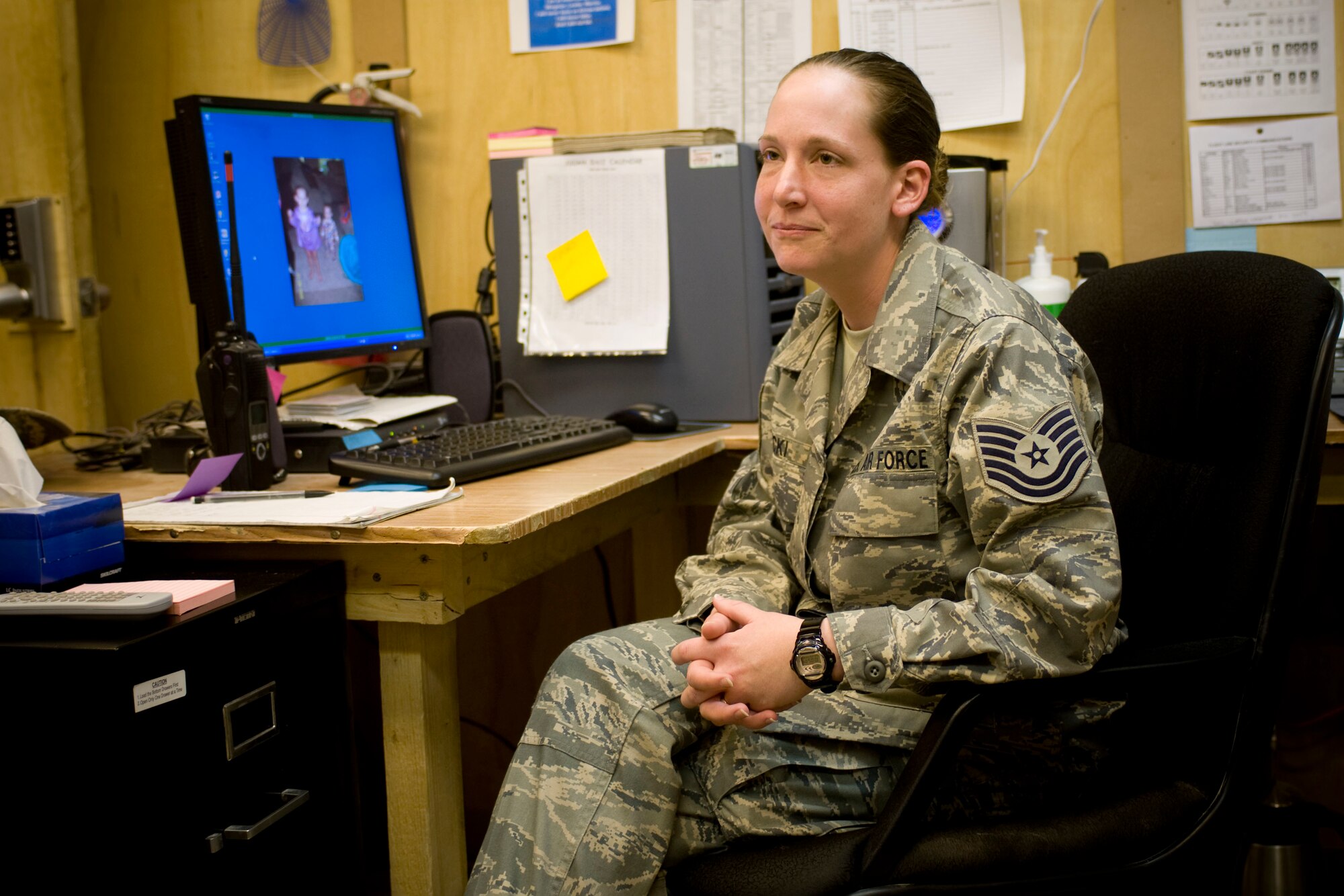 Tech. Sgt. Kristy Konicki, 451st Air Expeditionary Wing command post NCO in charge, sits in the new command post at Kandahar Air Field, Afghanistan, Oct. 25. The command post was officially stood-up in September in an effort to increase command and control for the geographically separated group. (U.S. Air Force photo by Staff Sgt. Samuel Morse)