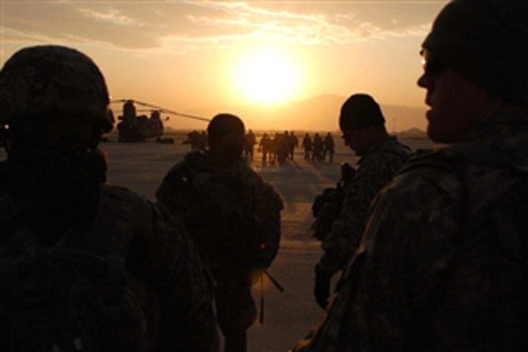 U.S. Army soldiers prepare to board a CH-47 Chinook helicopter for an air assault mission on Bagram Air Field, Afghanistan, Nov. 1, 2008. The soldiers are assigned to Company A, 101st Division Special Troop Battalion. 