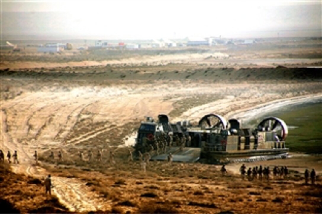 Middle Eastern military forces disembark a U.S. Navy landing craft air cushioned during a live-fire rehearsal of the final exercise with the 26th Marine Expeditionary Unit during Red Reef 2008 in the Middle East, Oct. 27, 2008.