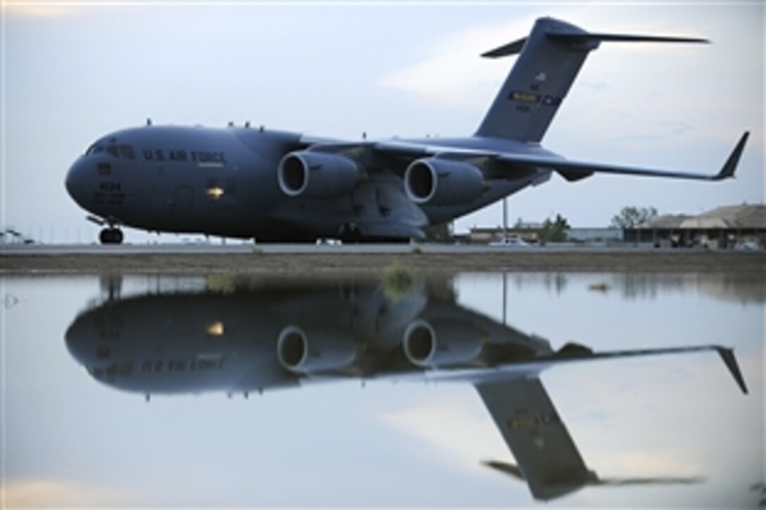 A C-17 Globemaster III lands in Southwest Asia, Nov. 1, 2008. The C-17 performs tactical airlift and airdrop missions, transports passengers, delivers troop resupply and all types of cargo throughout Southwest Asia in support of Operation Enduring Freedom and Operation Iraqi Freedom.