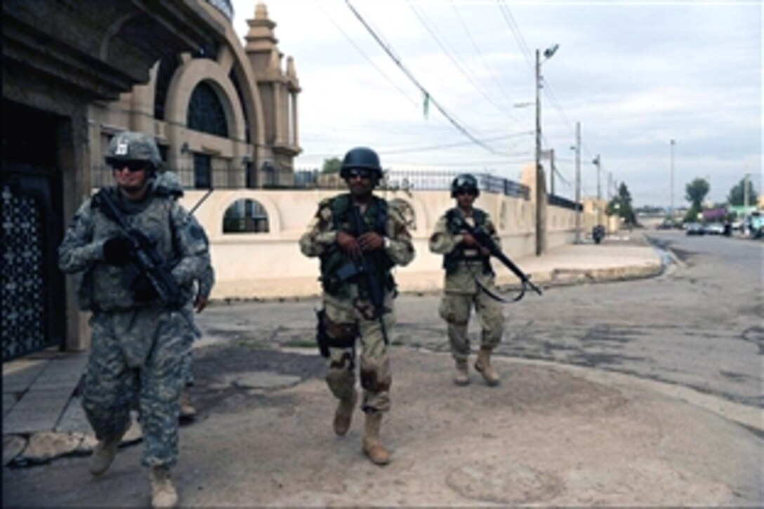 U.S. Army 1st Lt. John Nimmons leads a patrol with Iraqi soldiers in Al Muhandiseen, Iraq, Oct. 30, 2008. The soldiers are assigned to the 3rd Armored Cavalry Regiment's 3rd Squadron.