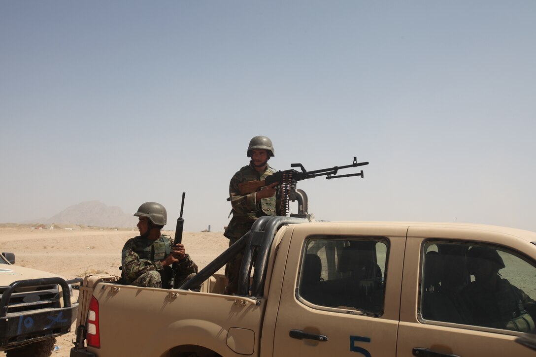Afghan National Army soldiers with the 2nd Brigade, 215th Corps, stand ready as the brigade’s Quick Reaction Force. The QRF are trained and prepared to employ at a moment’s notice, and are on call to respond to emergencies that require their immediate assistance