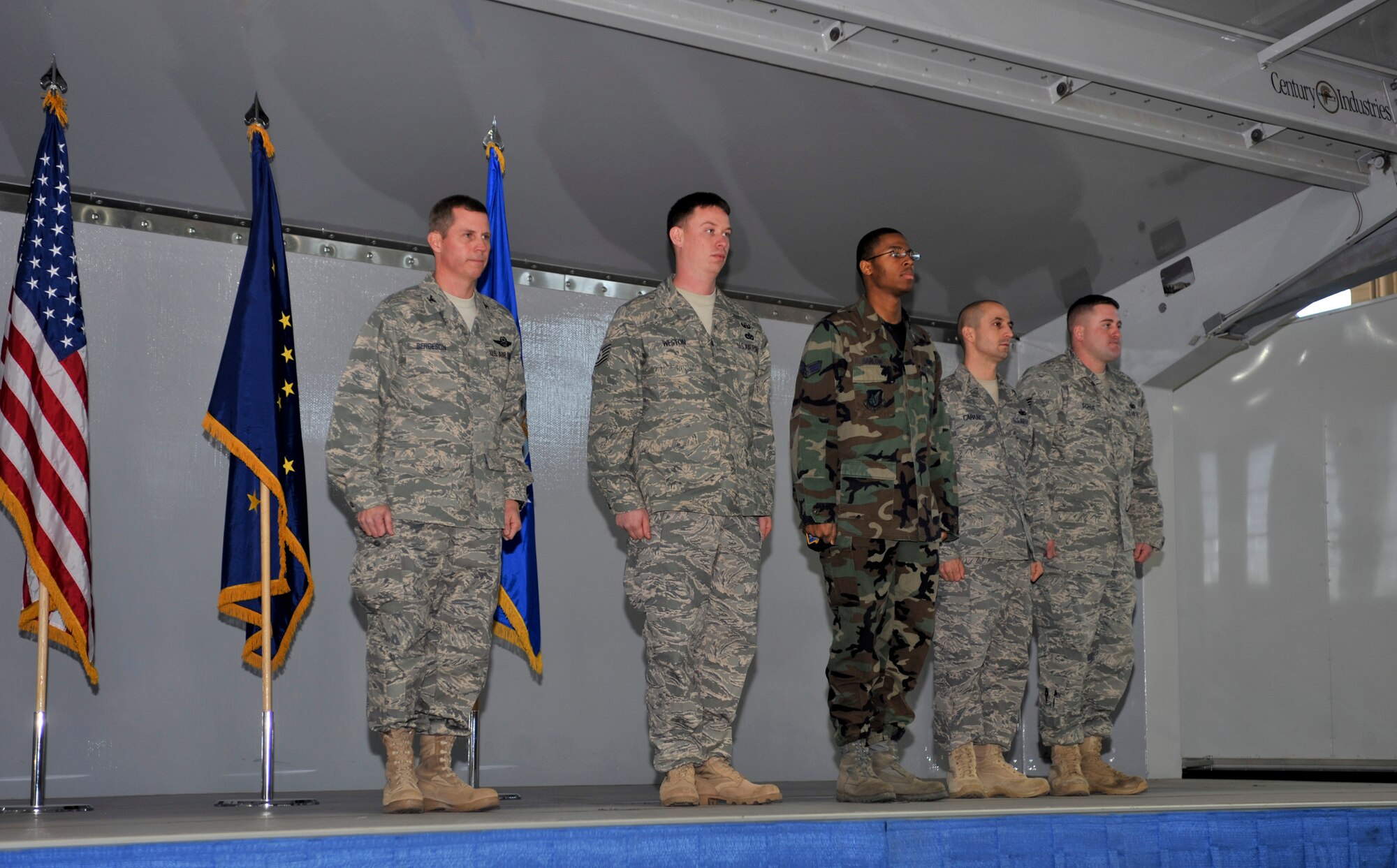 ELMENDORF AIR FORCE BASE, Alaska -- Col. Thomas Bergeson, 3rd Wing commander, prepares to give four active-duty Air Force members medals during the Arctic Warrior Welcome Home luncheon Oct. 31. Colonel Bergeson awarded a bronze star, two combat action medals and provided a purple heart to the members. (U.S. Air Force photo/Senior Airman Tinese Treadwell)