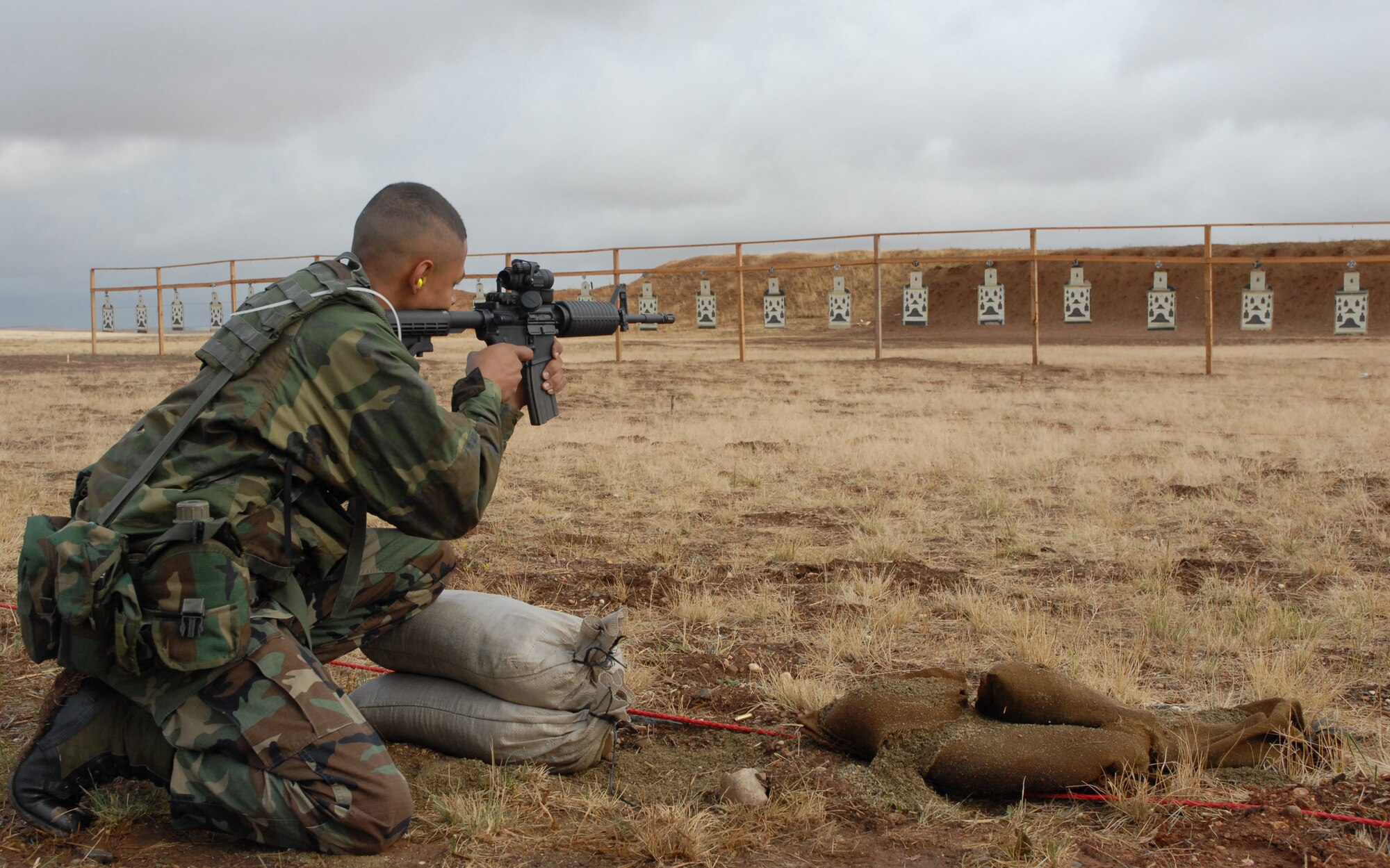 BEALE AIR FORCE BASE, Calif. -- Air Force Reservist Senior Airman Roger Moore from the 940th Air Refueling Wing's Security Forces Squadron sights his M-4 rifle down range at a weapons qualification shoot during the November unit training assembly weekend here. 940th SFS Airmen are required to maintain the same level of combat readiness as their active duty counterparts.  (U.S. Force Photo/ Tech. Sgt. Luke Johnson)