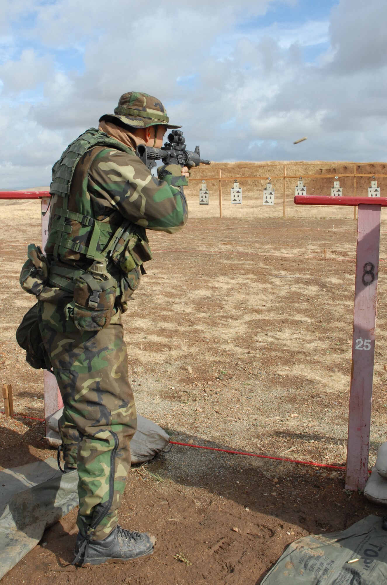 BEALE AIR FORCE BASE, Calif. -- Air Force Reservist Tech. Sgt. Kenneth Dealtonaga, with the 940th Security Forces Squadron, fires rounds down range at an M-4 qualification shoot, during the November unit training assembly weekend here. 940th SFS Airmen are required to maintain the same level of combat readiness as their active duty counterparts.  (U.S. Force Photo/ Tech. Sgt. Luke Johnson)