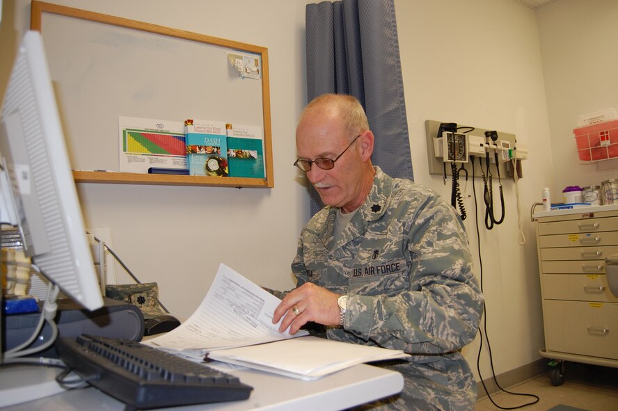 Lt. Col. Michael Doyle, a physician assistant in the 419th Medical Squadron and a Vietnam veteran, reviews paperwork during the wing's November unit training assembly. Colonel Doyle joined the Air Force Reserve after the Sept. 11 attacks of 2001. 