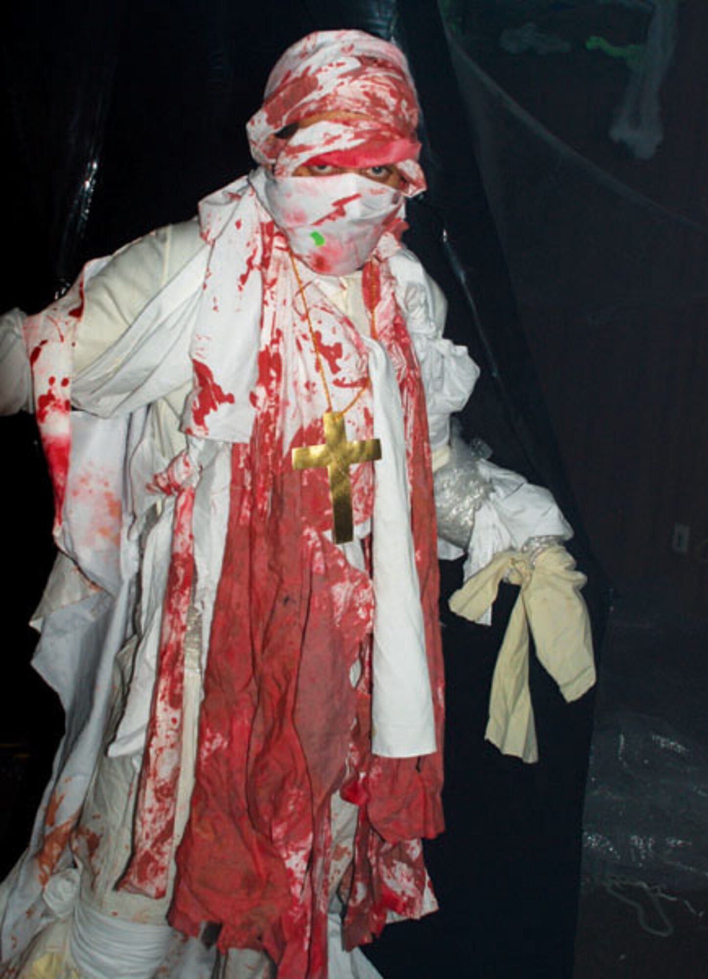 Airman Michael Dimondo glares at people as they walk through the haunted house Oct. 24.

