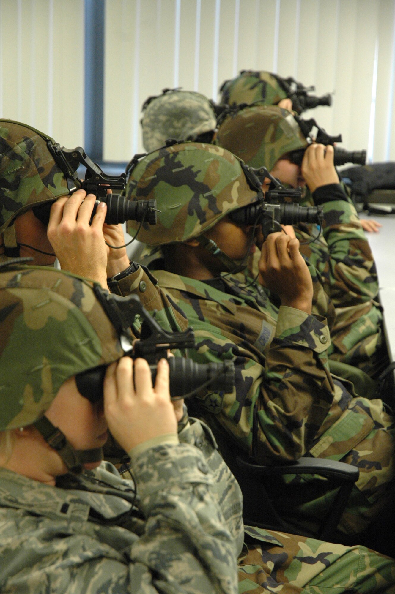 Students in the U.S. Air Force Expeditionary Center's Advanced Contingency Skills Training Course 09-2 learn how to utilize the ANPVS 7D night vision goggles during a night operations class on Fort Dix, N.J., Oct. 29, 2008.  ACST is a pre-deployment training course hosted by the Expeditionary Operations School at the USAF EC. (U.S. Air Force Photo/Staff Sgt. Paul R. Evans)