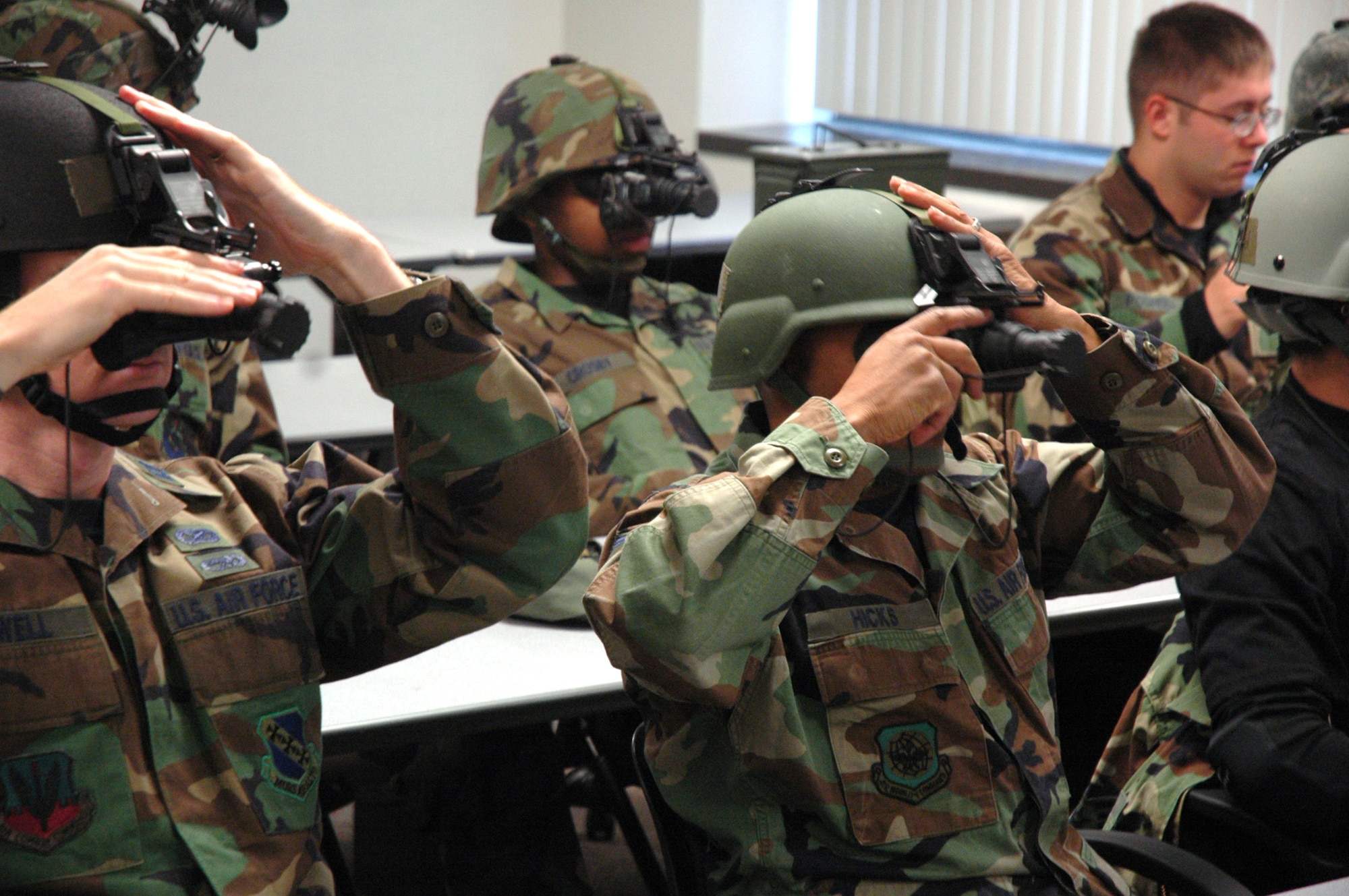 Students in the U.S. Air Force Expeditionary Center's Advanced Contingency Skills Training Course 09-2 learn how to utilize the ANPVS 7D night vision goggles during a night operations class on Fort Dix, N.J., Oct. 29, 2008.  ACST is a pre-deployment training course hosted by the Expeditionary Operations School at the USAF EC. (U.S. Air Force Photo/Staff Sgt. Paul R. Evans)