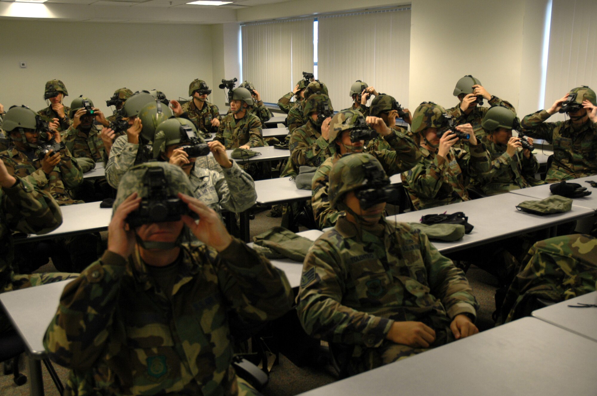 Students in the U.S. Air Force Expeditionary Center's Advanced Contingency Skills Training Course 09-2 learn how to utilize the ANPVS 7D night vision goggles during a night operations class on Fort Dix, N.J., Oct. 29, 2008.  ACST is a pre-deployment training course hosted by the Expeditionary Operations School at the USAF EC. (U.S. Air Force Photo/Staff Sgt. Paul R. Evans)